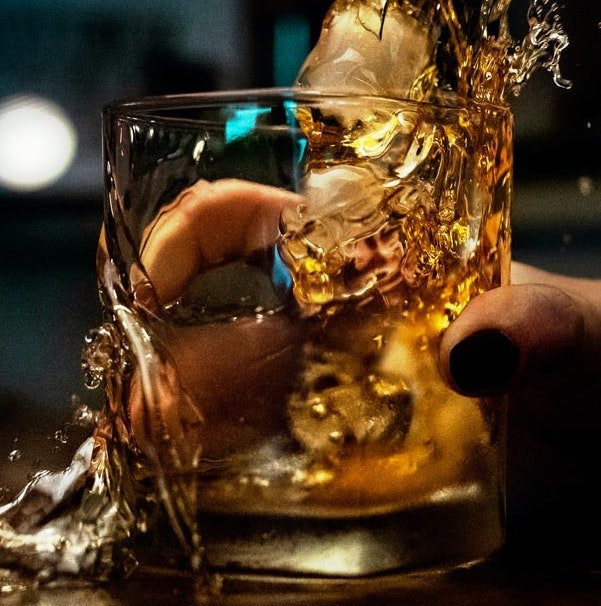 image of a shaken whiskeyglass